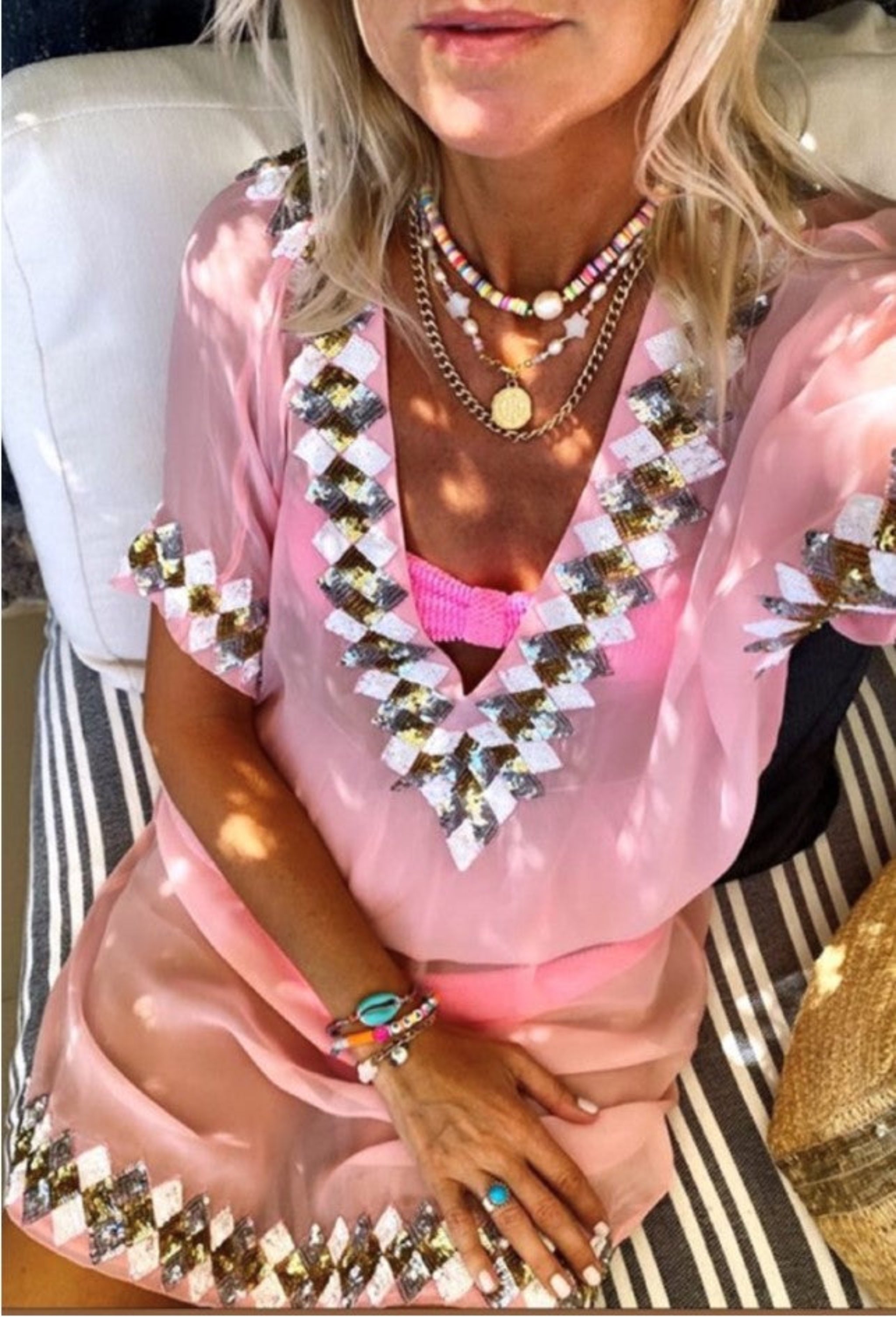 Pink Silk Designer Kaftan named Miami worn by Anna Mavridis is so pretty in this pastel pink shade. Designed by Lindsey Brown, Miami is a drop waisted designer kaftan, semi sheer and perfect for those wanting to cover up and needing a longer length. Taking inspiration from our Manhattan style, Miami shares the same low VBack and neckline