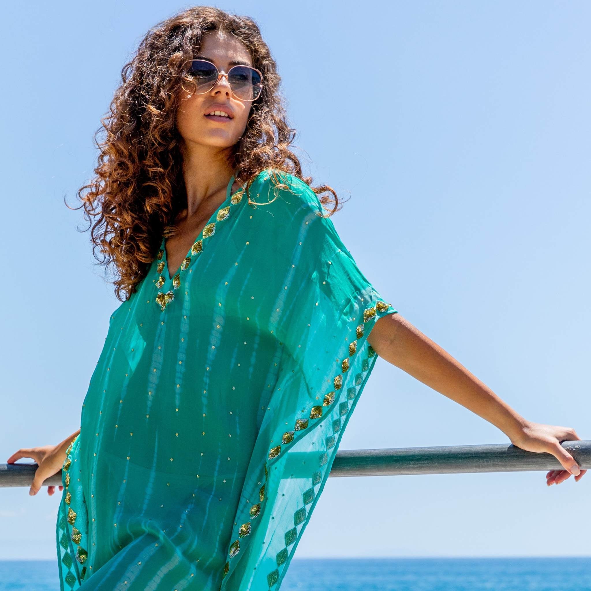 aqua floaty silk kaftans to wear over swimwear y Lindsey Brown resort wear