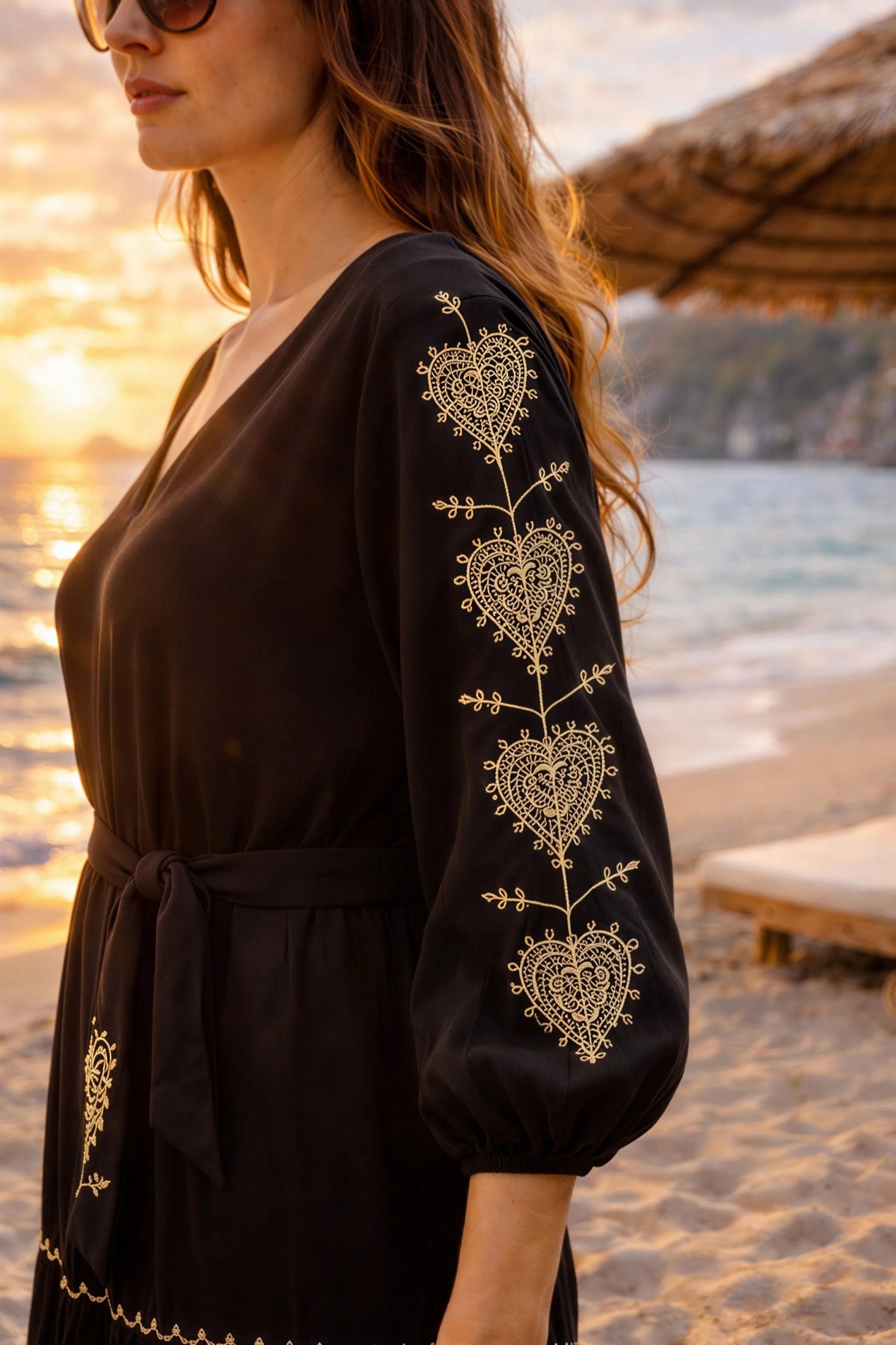 black cotton beach dress long sleeves with pretty gold embroidery to wear on cooler beach days by lindsey brown