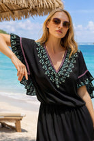 black cotton embroidered beach dresses to wear on a caribbean cruise holiday by lindsey brown resort wear 