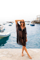 Black loose fitting silk kaftans to wear over swimwear by Lindsey Brown resort wear 