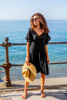 black cotton beach dress to wear on holiday by  Lindsey Brown resort wear 