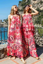 pink printed sleeveless dresses for vacation by Lindsey Brown resort wear