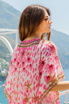 pink floaty rounded silk beach cover ups to wear over swimwear by Lindsey Brown luxury resort wear 