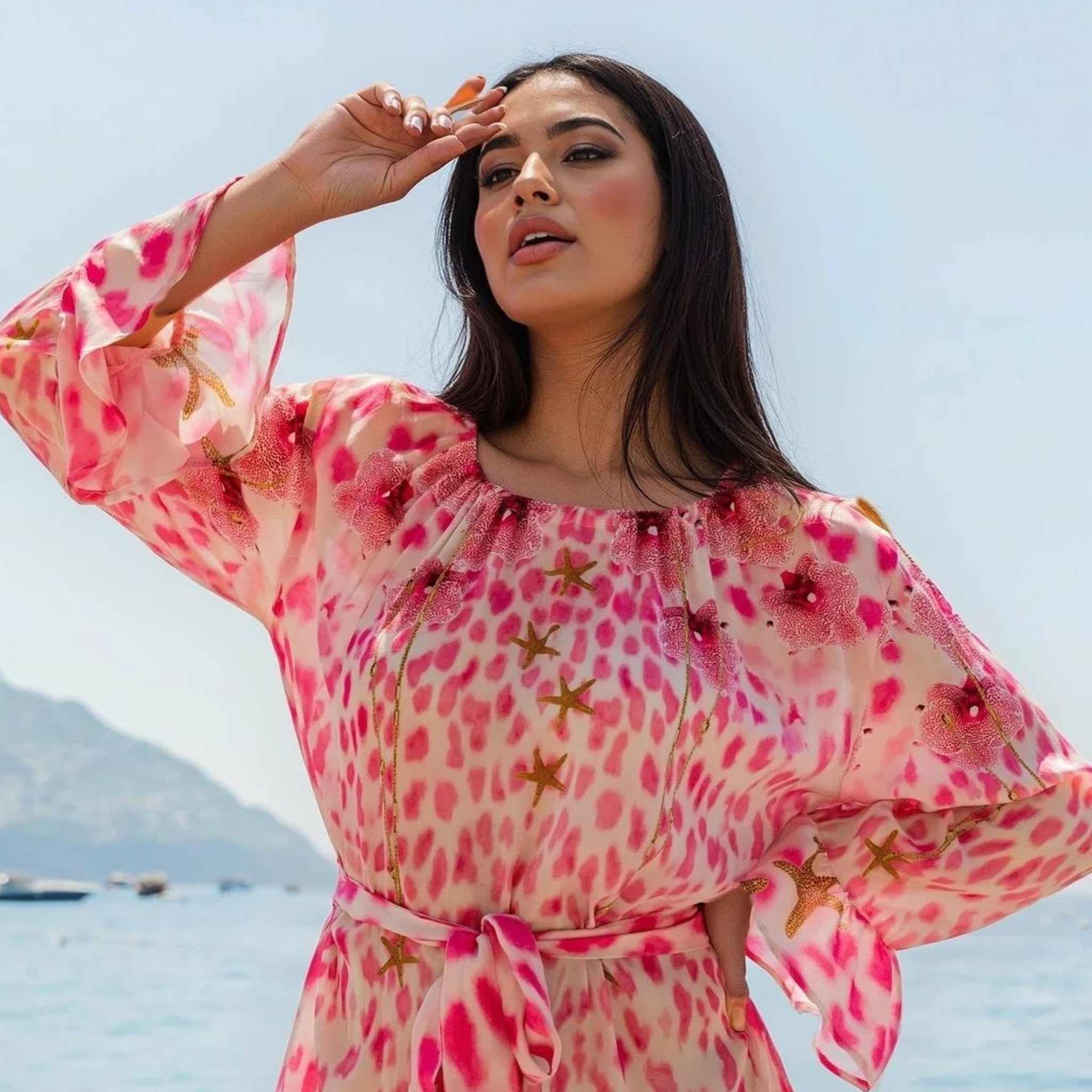 pink silk animal print long sleeved dress to wear on holiday by Lindsey Brown