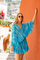turquoise blue silk kaftans to wear on holiday by Lindsey Brown resort wear