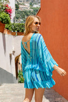 turquoise blue silk kaftan dresses to wear on vacation by Lindsey Brown resort wear