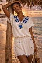 white cotton designer v neck beach dress for caribbean holidays by lindsey brown resort wear 