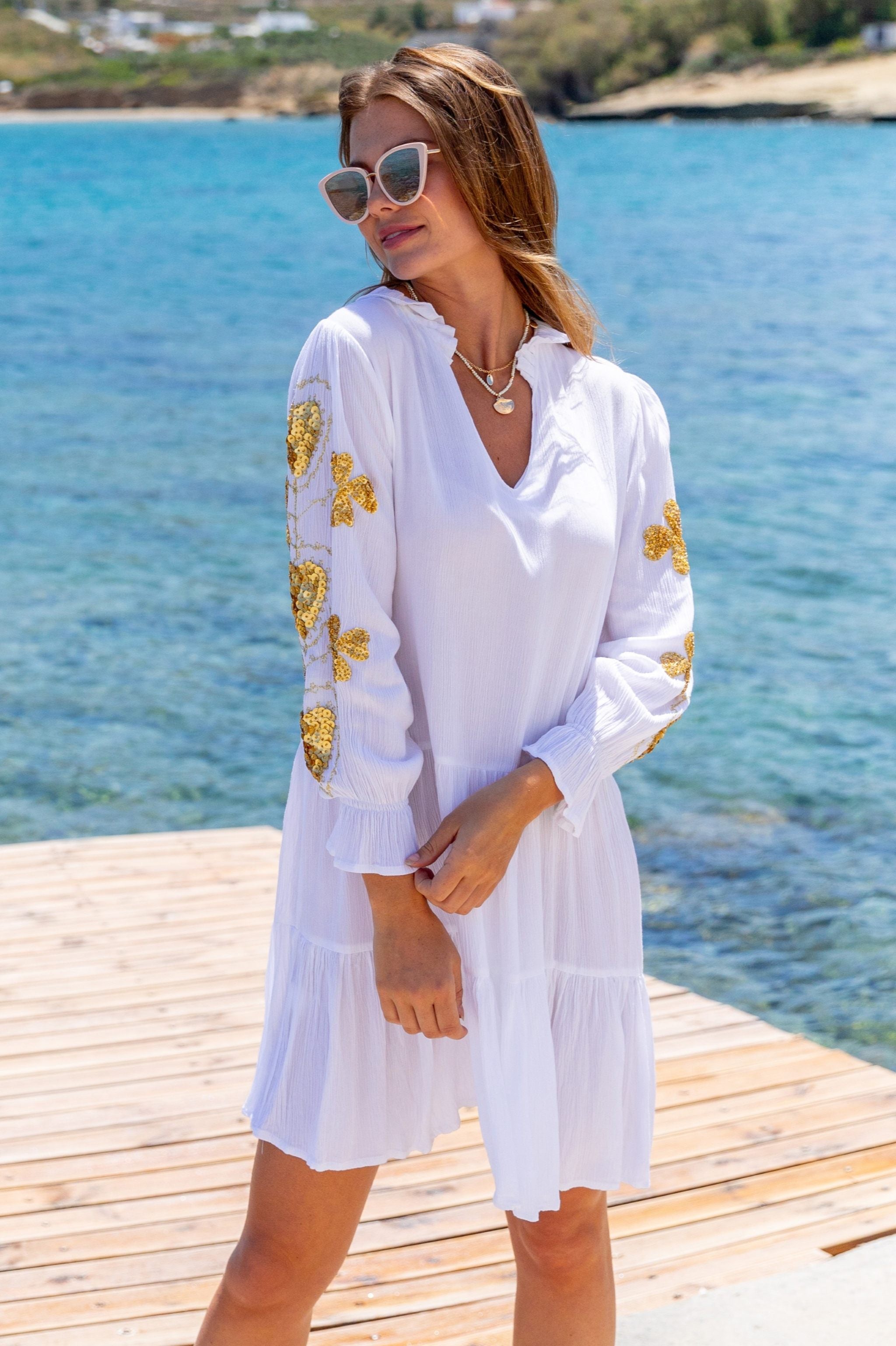 White and gold cotton beach dresses  by Lindsey Brown 