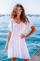 White cotton beach dress to wear in the Caribbean by Lindsey Brown resort wear 