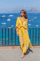 Yellow silk floaty maxi kaftans to wear on holiday by Lindsey Brown resort wear 