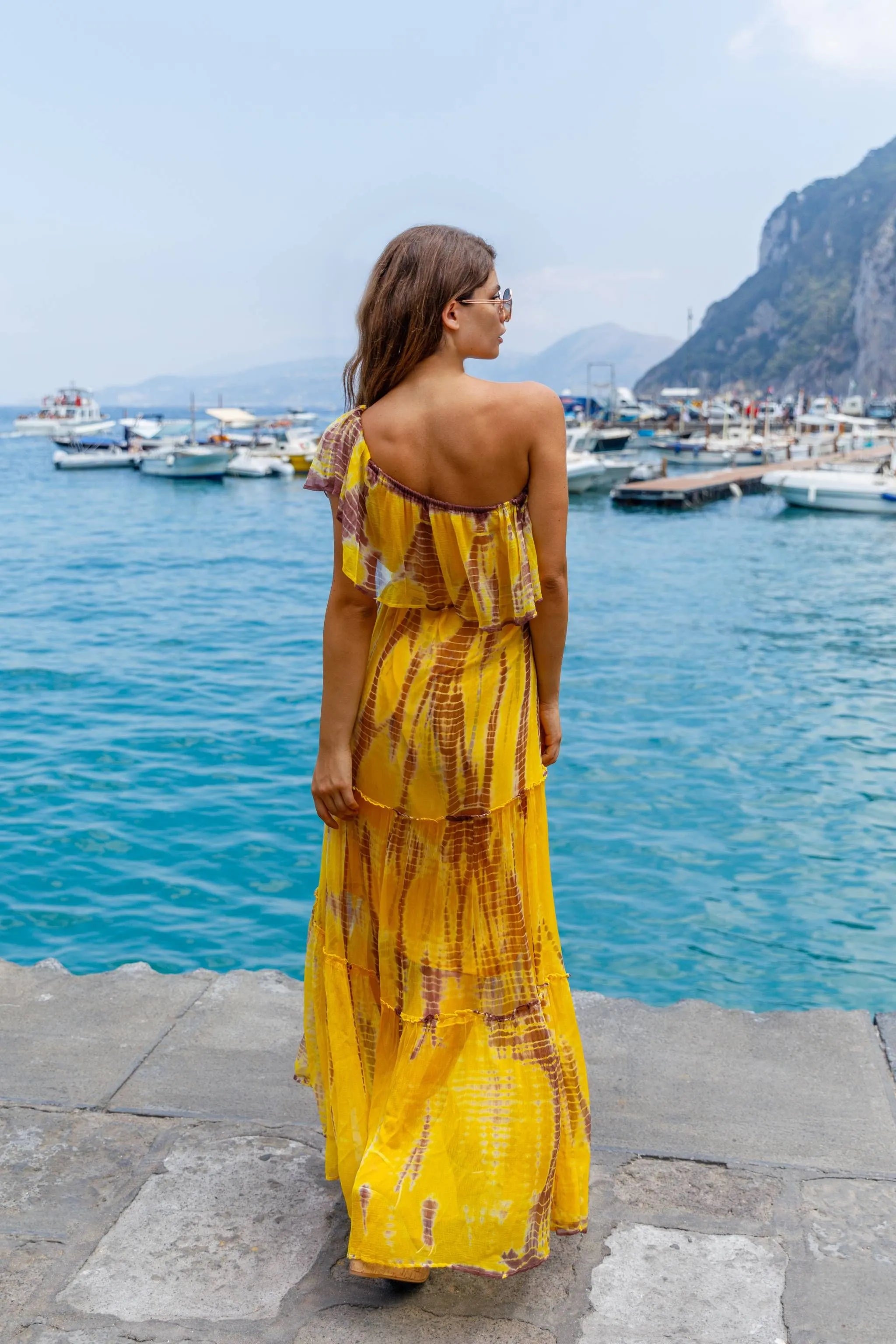 yellow and bronze silk tie dye maxi dress to wear on a luxury holiday by Lindsey Brown